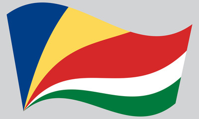 Flag of Seychelles waving on gray background