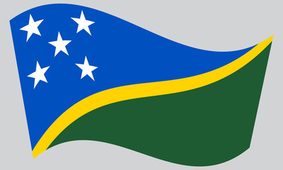 Flag of Solomon Islands waving on gray background