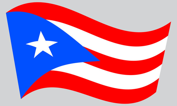 Flag of Puerto Rico waving on gray background