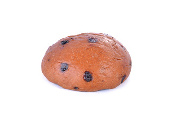 black chocolate chip bun on white background