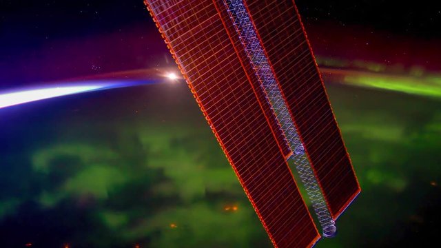 International Space Station (ISS) travelling above Aurora Borealis over North American Horizon. Created from Public Domain images, courtesy of NASA JSC : http://eol.jsc.nasa.gov. Subtle motion effect