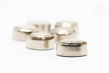 small watch rusty batteries isolated on white background