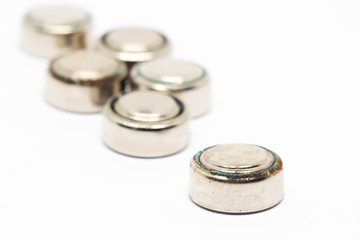 small watch rusty batteries isolated on white background