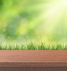 Obraz premium green turf with wooden grain