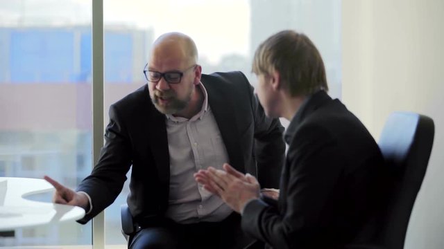 Boss is angry with his subordinate employee in the office and dismissal him