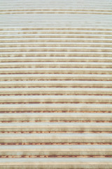 Old rusty metal sheet rooftop in a bright day.