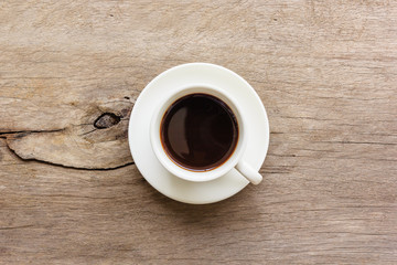 Coffee cup on wooden table, Top view with copy space and text