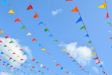 Colorful triangle flags hung across the beautiful blue sky.