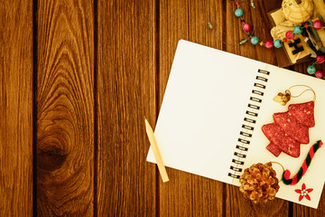 Naklejka na ściany i meble Greeting, Blank paper notebook With Christmas decoration on wood