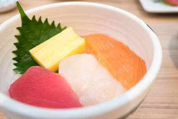 salmon tuna japanese rolled omelette on rice bowl called seafood