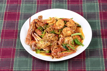 Stir-fried crab and shrimp in curry power is top-ten of popular Thai food as seafood to fried with  fresh milk ,grill curry ,egg ,oyster oil and yellow curry powder. 