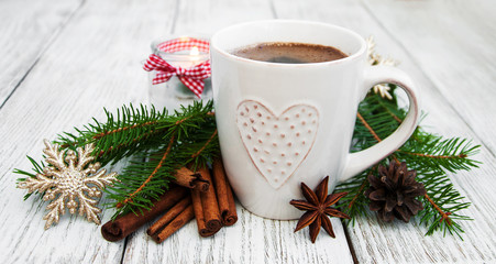 Obraz na płótnie Canvas Cup of coffee and christmas decoration
