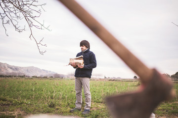 man chopping wood with an ax