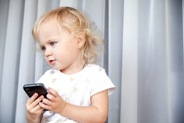 Little girl talking on mobile phone