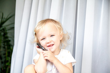 Little girl talking on mobile phone