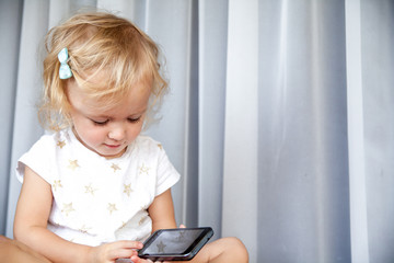 Little girl talking on mobile phone