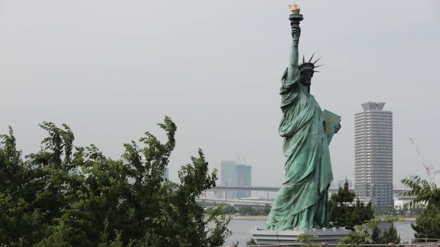 Statue of Liberty replica at Odaiba in Tokyo Bay, pan.