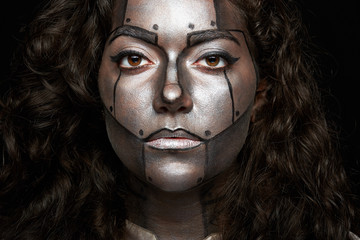 headshot of women with painted face