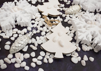 Christmas or New Year background: snowflakes, gifts, glass balls, decoration and cones on dark background