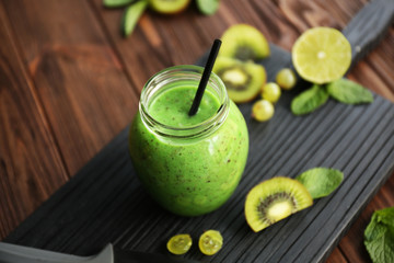 Refreshing fruit smoothie on table