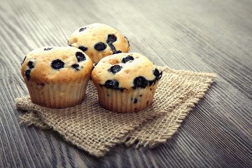 muffin with blueberries on a wooden table. fresh berries and swe