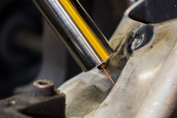 Close up robot welding in new position for welding