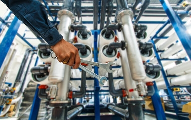 mechanic holding a wrench Water filters Food Factory