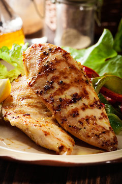 Grilled chicken breasts served with grilled paprika