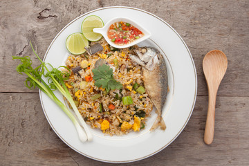Fried rice with mackerel, egg, carrots, kale, spinach, egg yolk.