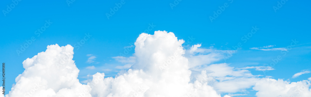 Wall mural clouds with blue sky background