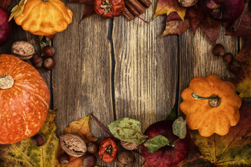Autumn frame with pumpkins, leaves, apples and nuts