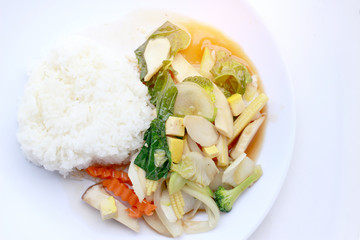 Stir Fried Tofu in Chinese Style,Deep Fried Tofu with Gravy Sauce ,Stir fried tofu with mixed vegetables in white plate on white background. Vegetarian Food, healthy food.