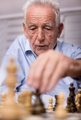 Senior men playing chess