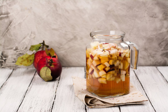 Apple Cider Sangria In A Glass Jar On Wooden Table