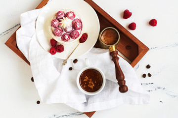 Morning breakfast with small berry tarts and coffee