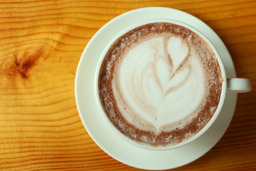 Coffee latte hot on wood table.