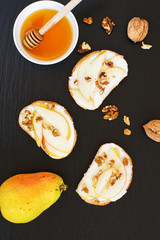 Pear bruschetta with cream cheese, nuts and honey