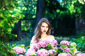 pretty girl in hydrangea flowers