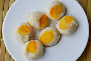 Chinese pastry filling sweet bean and salty egg yolk on dish