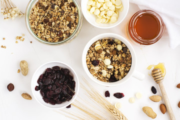 Homemade granola with fruits and white chocolate drops