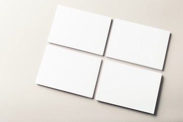 blank business cards on grey background