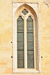 Fototapeta na wymiar The medieval window in the old church.