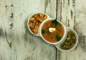 Pumpkin soup with croutons and seeds