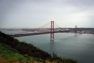 Fototapeta na wymiar 25 de Abril Bridge (Ponte 25 de Abril), Lisbon, Portugal