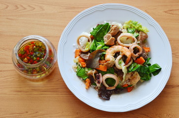 stir fried mixed vegetable with seafood and chili fish sauce