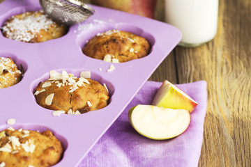 Apple cupcakes over wooden table