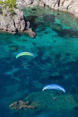 Tuinposter aerial view of the paraglider over the coast line © mariusz szczygieł