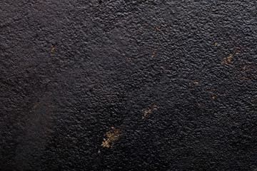 The bottom of the old cast-iron frying pan