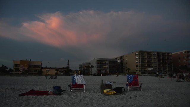 Empty beach chairs and blankets, Madeira Beach vacation footage, Florida
