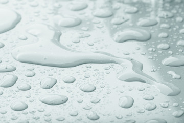 Drops of water on a color background. Gray. Shallow depth of fie